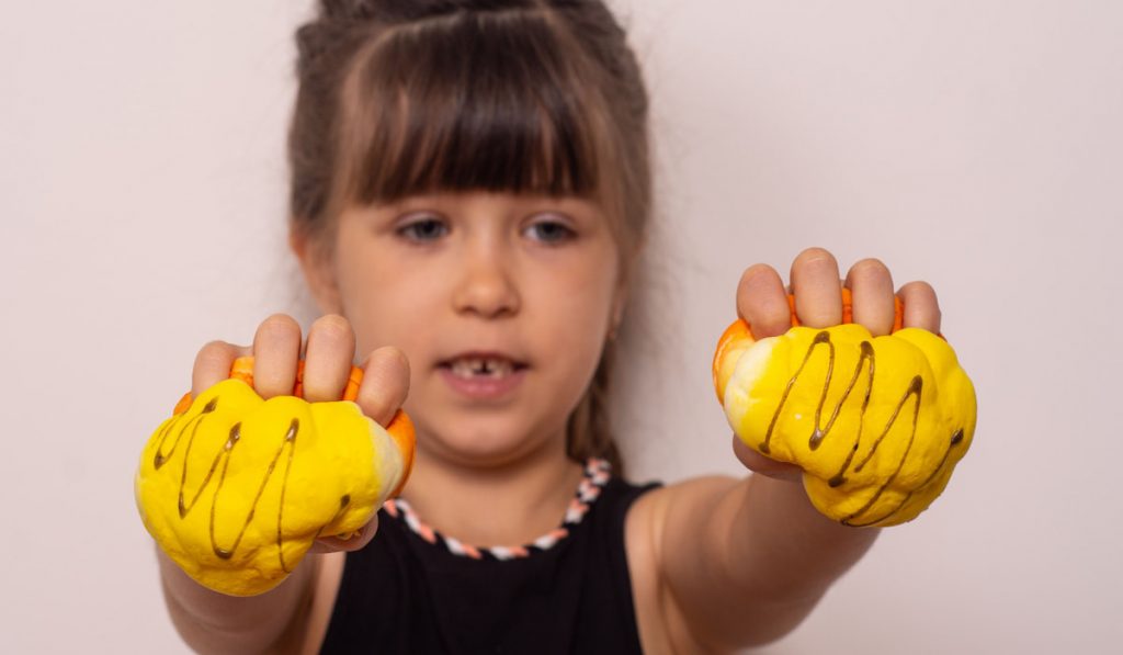 Kid playing squishy hand made toy