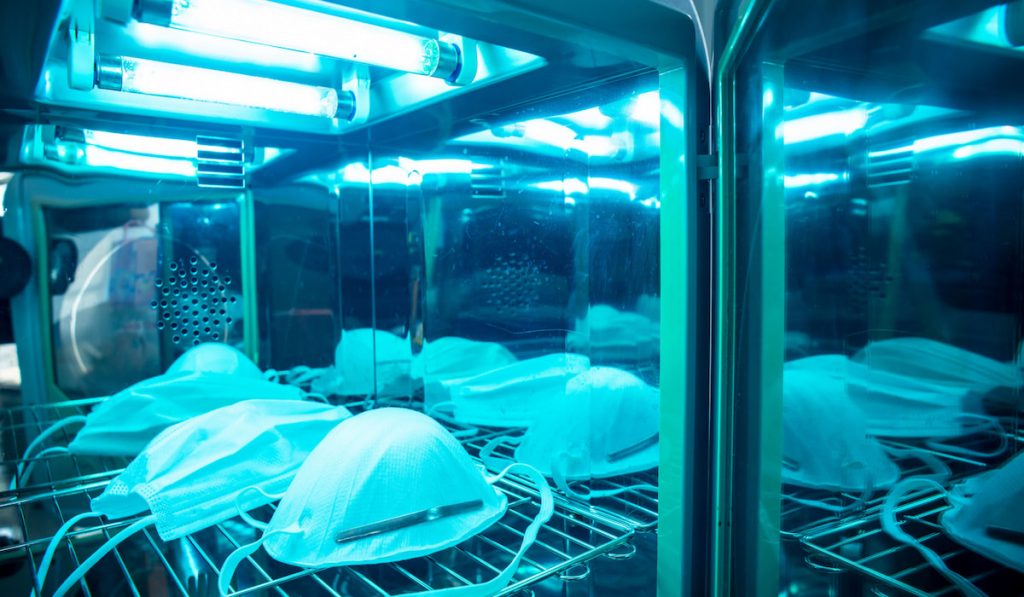 UV light sterilization of face mask to disinfect