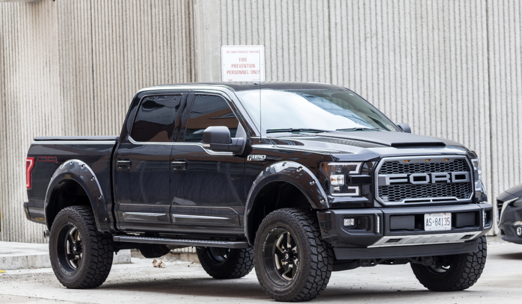 Black Ford F 150 SVT Raptor Dakar Edition on a parking lot in the city of Toronto