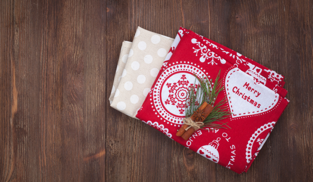 Christmas kitchen towel on the wooden background