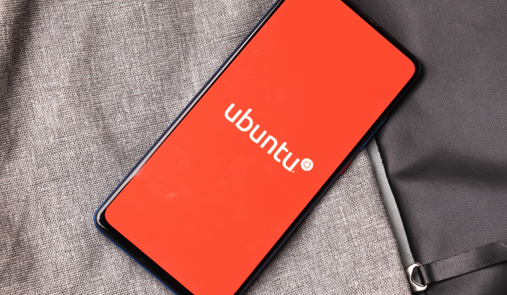  Ubuntu logo on phone screen stock image.