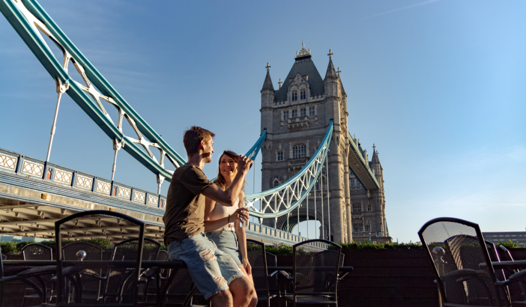 Couple enjoy sunset with beer