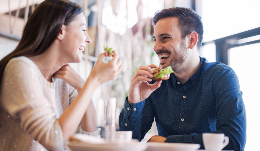 Happy loving couple enjoying breakfast