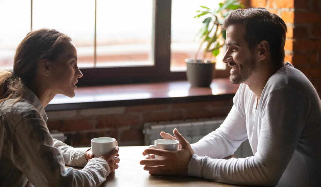 couple talking in cozy coffeeshop